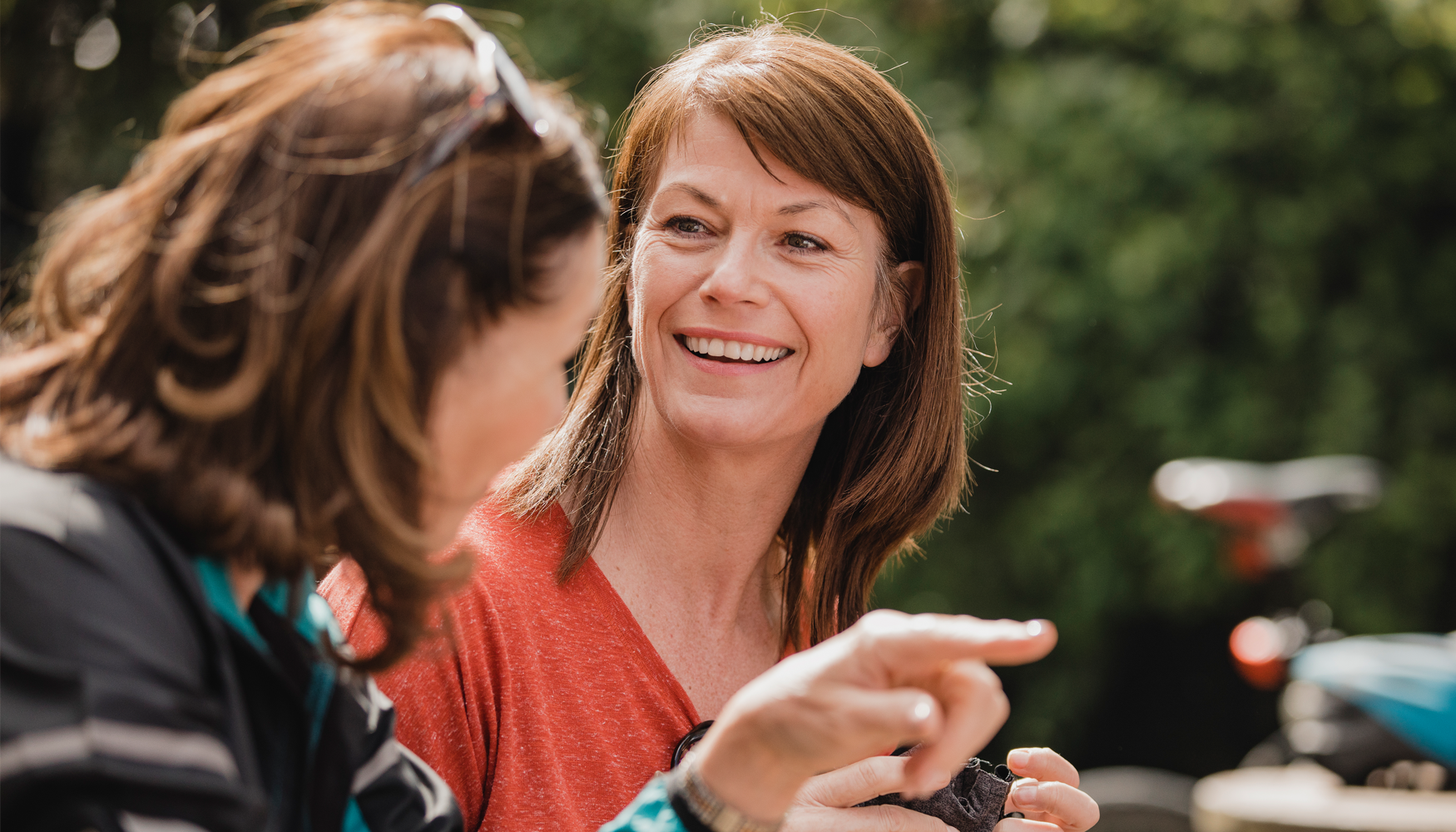 A photo of two women who appear to be peers supporting one another in their treatment journey.